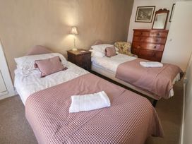 A bedroom with two beds and a chest of drawers at The Plover in Blakeney, Norfolk