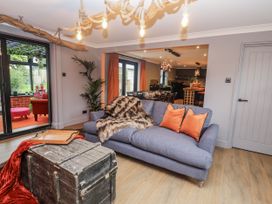 A living room with sofa and coffee table at Holly Farm in Brantham