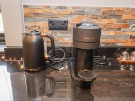 A kettle and coffee machine on a countertop at Holly Farm in Brantham