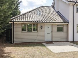 An exterior view of a property with a door and windows at Annexe in Colchester