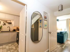 A kitchen with a washing machine and sink at 21 Olympic Way Plymouth