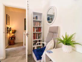 A study with a chair and bookshelves at 21 Olympic Way Plymouth