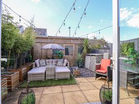 A garden with patio furniture and plants at 21 Olympic Way Plymouth