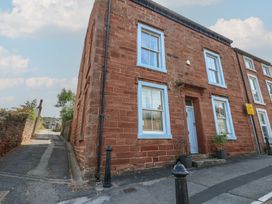 A building exterior with windows and a front door at Hampton House St. Bees