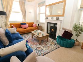 A living room with a sofa and coffee table at Hampton House in St. Bees