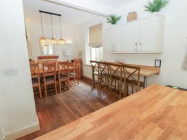 A dining room with a table and chairs at Hampton House St. Bees