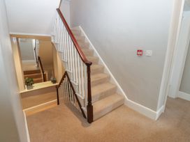 A staircase with a plant at Hampton House in St. Bees