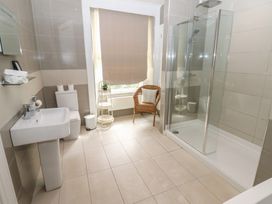 A bathroom with sink, toilet, and shower at Hampton House in St. Bees
