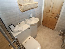 A bathroom with a toilet and sink at Hampton House in St. Bees