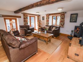 A living room with sofas and a coffee table at Lane End in North Molton