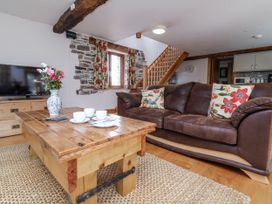 A living room with a sofa and coffee table at Lane End in North Molton