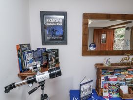 A display with telescope and books at Lane End in North Molton