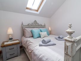 A bedroom with a bed and bedside table at Lane End in North Molton