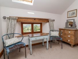 A study with a table and chairs at Lane End in North Molton