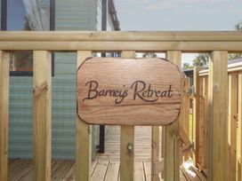 A wooden sign at the entrance of Barnes Retreat in Carnforth