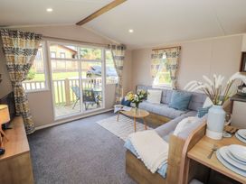 A living room with a sofa and coffee table at Barnes Retreat in Carnforth