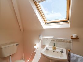 A bathroom with a toilet and sink at Knockroe Lodge 