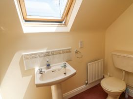 A bathroom with a sink and toilet at Knockroe Lodge 