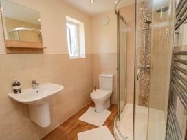 A bathroom with a shower and toilet at Scalby Grove Cottage, Scalby
