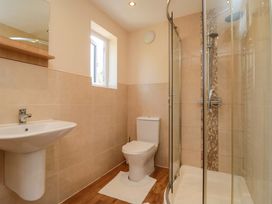 A bathroom with a sink, toilet, and shower at Scalby Grove Cottage, Scalby