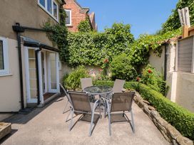 An outdoor area with a table and chairs at Scalby Grove Cottage in Scalby
