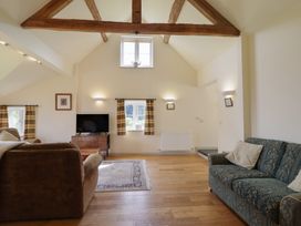 A living room with sofa and television at Upper Pandy Farm in Welshpool