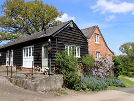 A house with a pathway and garden at Upper Pandy Farm Berriew near Welshpool