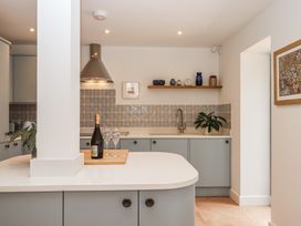 A kitchen with a countertop and sink at Jams in Lympstone