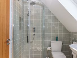 A bathroom with a shower and toilet at Jams in Lympstone