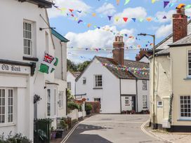 A street with houses decorated with bunting at Jams in Lympstone