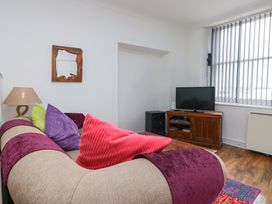 A living room with a sofa and television at Duncan Square in Whitehaven