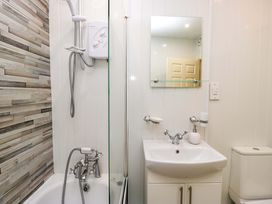 A bathroom with a shower and sink at Duncan Square in Whitehaven