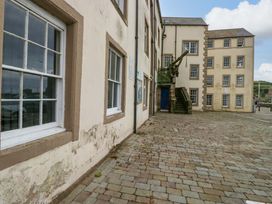 An outdoor view of buildings with windows and steps at Duncan Square in Whitehaven