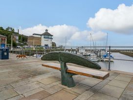 A sculpture bench near a marina at Duncan Square in Whitehaven