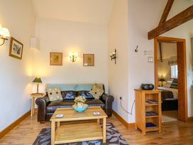 A living room with a sofa and coffee table at The Kiln in Mendham near Harleston