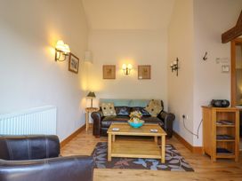 A living room with a sofa and coffee table at The Kiln in Mendham near Harleston