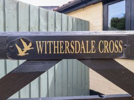 A sign indicating Withersdale Cross at The Kiln in Mendham near Harleston