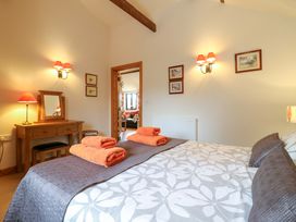 A bedroom with a bed and towels on it at The Golden Cross in Mendham near Harleston