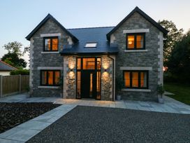 A house with stone exterior and garden at Ty Landsker in Houghton near Neyland