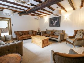 A living room with sofas and a coffee table at Stud Farm House Bleddfa near Knighton