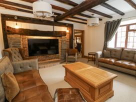 A living room with a TV and seating area at Stud Farm House Bleddfa near Knighton