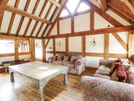 A living room with a coffee table and sofas at Stud Farm House Bleddfa near Knighton