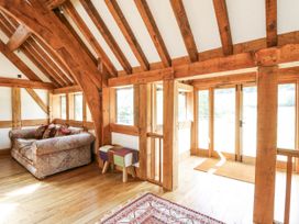 A living room with a sofa and rug at Stud Farm House Bleddfa near Knighton