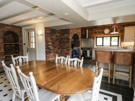 A dining room with a table and chairs at Stud Farm House in Bleddfa near Knighton