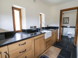 A bathroom with a sink and toilet at Stud Farm House in Bleddfa near Knighton