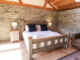 A bedroom with a bed and nightstand at Stud Farm House Bleddfa near Knighton