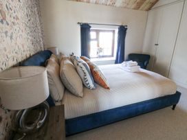 A bedroom with a bed and window at Stud Farm House Bleddfa near Knighton