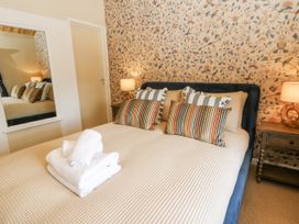 A bedroom with a bed and decorative pillows at Stud Farm House Bleddfa near Knighton