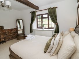 A bedroom with a bed and a window at Stud Farm House in Bleddfa near Knighton