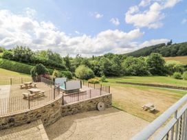 An outdoor area with seating and greenery at Stud Farm House in Bleddfa near Knighton